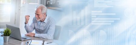 Satisfied senior businessman clenching his fist; panoramic banner
