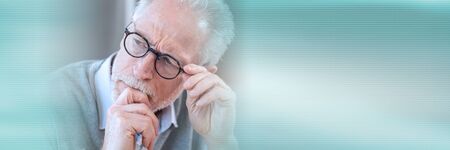 Portrait of pensive senior businessman; panoramic bannerの写真素材