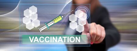 Woman touching a vaccination concept on a touch screen with her fingerの写真素材