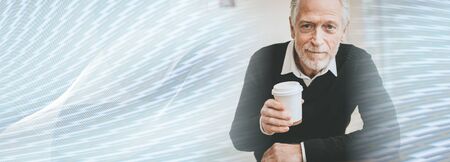 Man having coffee break at home; panoramic banner