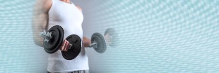 Athletic man working with heavy dumbbells; panoramic bannerの写真素材