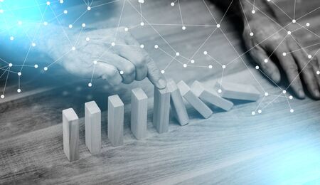 Business control concept by stopping domino effect; light effect