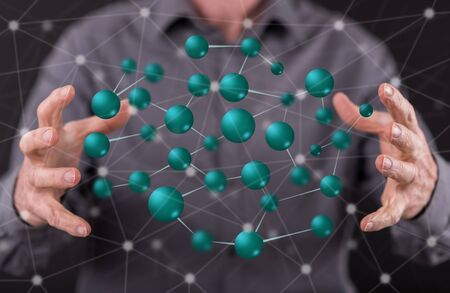 Network concept between hands of a man in backgroundの写真素材