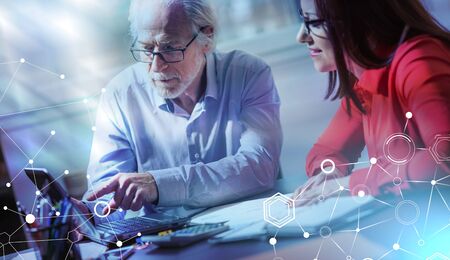 Businesspeople working together in office; light effect