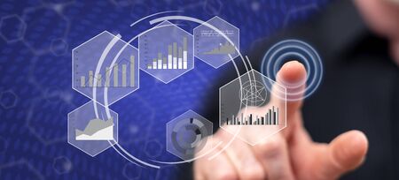 Man touching a data analysis concept on a touch screen with his finger