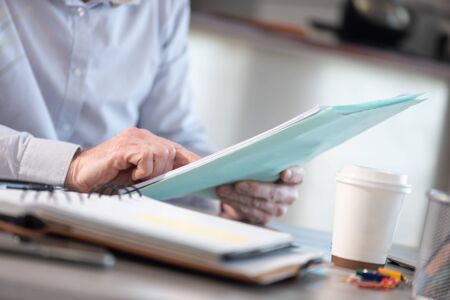 Businessman checking a document in office