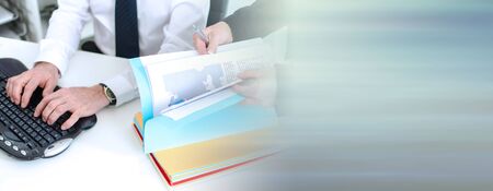 Businessmen and a colleague working together at the office; panoramic bannerの写真素材