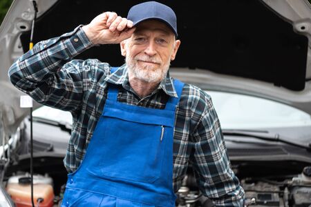Portrait of senior car mechanicの写真素材