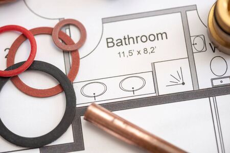 Plumbing equipment on a blueprintの写真素材