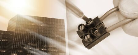 Clamping a wire in a connector, closeup; multiple exposure