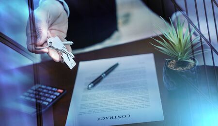 Real estate agent showing house keys after contract signing; multiple exposure