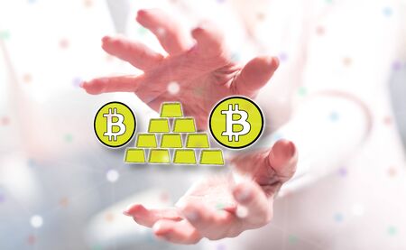 Bitcoin virtual gold concept between hands of a woman in backgroundの写真素材