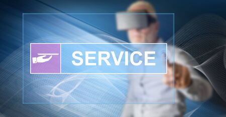 Man with vr headset touching a customer service concept on a touch screen with his fingerの写真素材