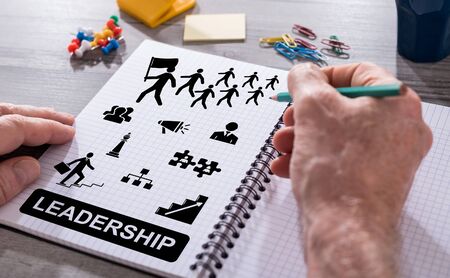 Hand drawing leadership concept on a notepadの写真素材