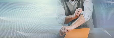 Motivated businessman rolling up his sleeves; panoramic bannerの写真素材