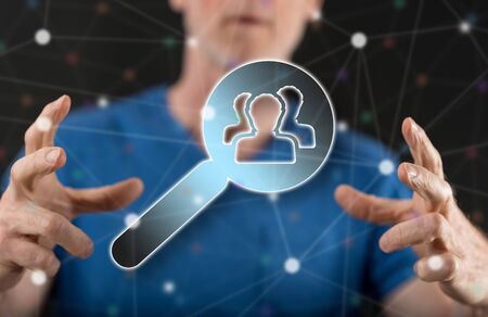 Recruitment concept between hands of a man in backgroundの写真素材