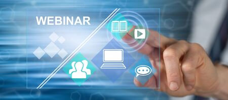 Man touching a webinar concept on a touch screen with his fingerの写真素材