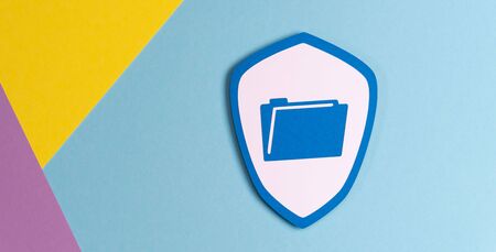 Concept of data protection with paper shield on pastel colors backgroundの写真素材