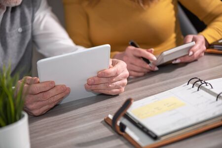 Coworkers working together at officeの写真素材