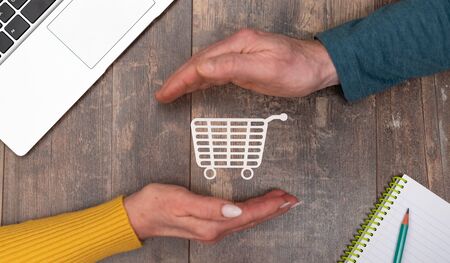 Concept of secure purchase with hands in a protective gesture