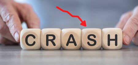 Concept of economic crash on wooden cubesの写真素材