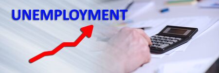 Concept of increase in unemployed with hand using calculator; panoramic bannerの写真素材