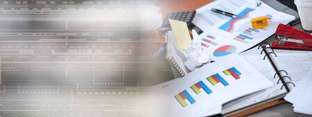 Messy and cluttered office desk; panoramic banner