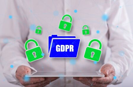Gdpr concept above a tablet held by a man in background