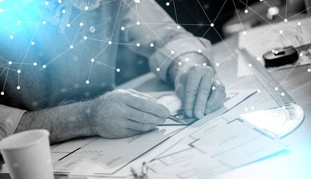 Architect working on a project and using a square; light effectの写真素材