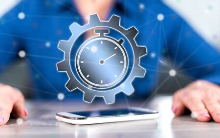 Smartphone with time management concept between hands of a woman in background