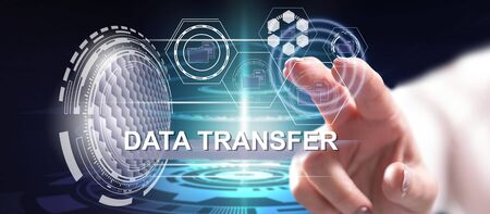 Woman touching a data transfer concept on a touch screen with her fingerの写真素材