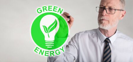Green energy concept drawn by a businessmanの写真素材