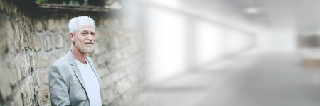 Portrait of handsome mature man, outdoors; panoramic banner