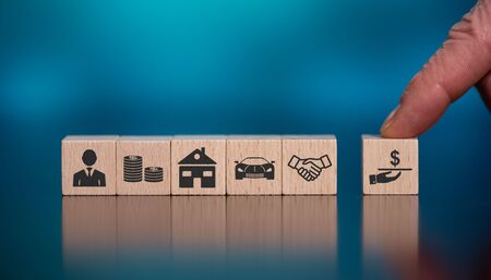 Concept of loan with icons on wooden cubesの写真素材