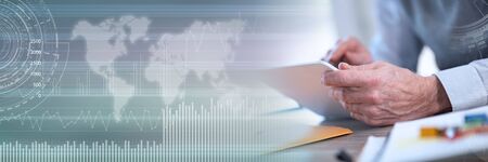 Businessman working on digital tablet, closeup; panoramic banner