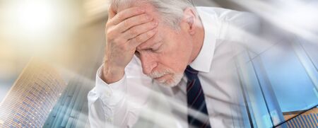 Stressed businessman sitting in office with hand on forehead; multiple exposure