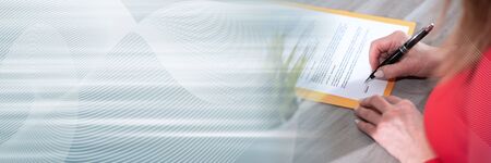 Businesswoman signing a contract; panoramic banner