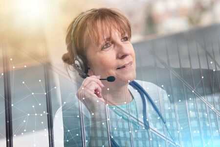Portrait of mature female doctor during online medical consultation; multiple exposure