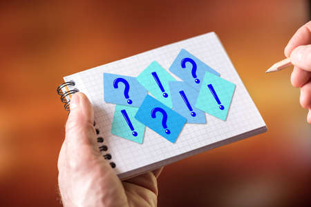 Hand drawing q&a concept on a notepadの写真素材