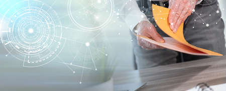 Businessman opening folder with paper documents; panoramic banner