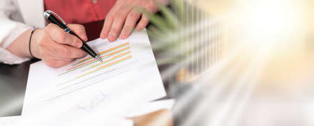 Businesswoman analysing marketing data; multiple exposureの写真素材