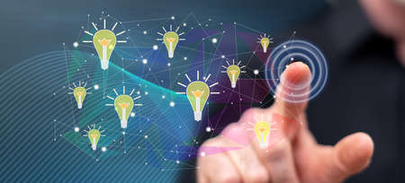 Man touching an innovation concept on a touch screen with his finger
