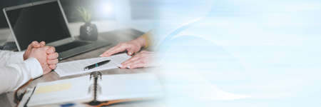 Situation of business negotiation between businesswoman and businessman; panoramic banner