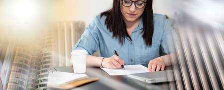 Businesswoman checking document in office; multiple exposure