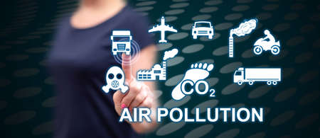 Woman touching an air pollution concept on a touch screen with her finger
