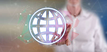 Man touching a global network concept on a touch screen with his finger