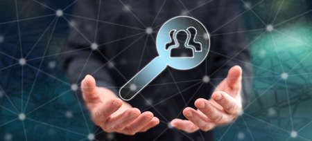 Recruitment concept above the hands of a man in backgroundの写真素材