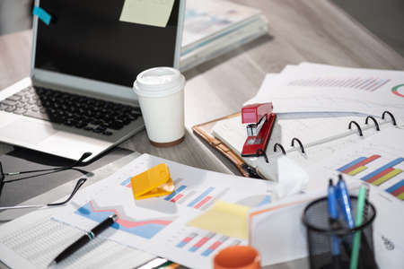 Messy and cluttered office desk
