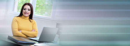 Portrait of young businesswoman working from home; panoramic banner