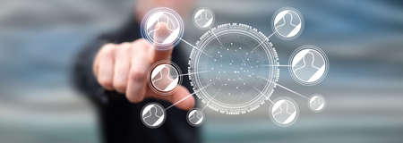 Man touching a social network concept on a touch screen with his fingerの写真素材
